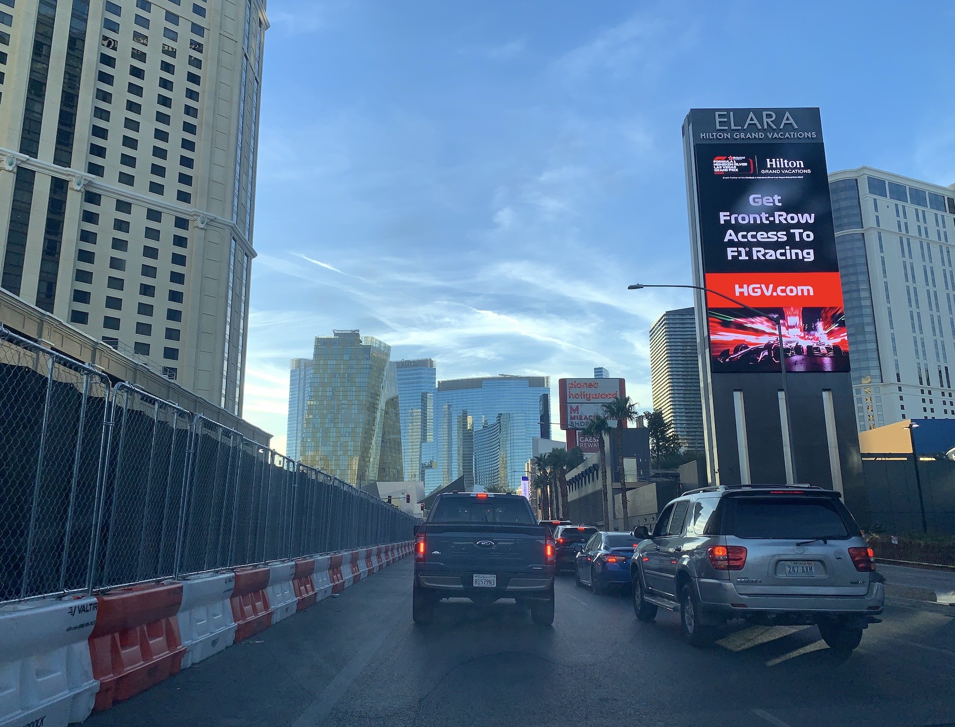City traffic on Las Vegas Grand Prix track by Elara, headed toward Aria.