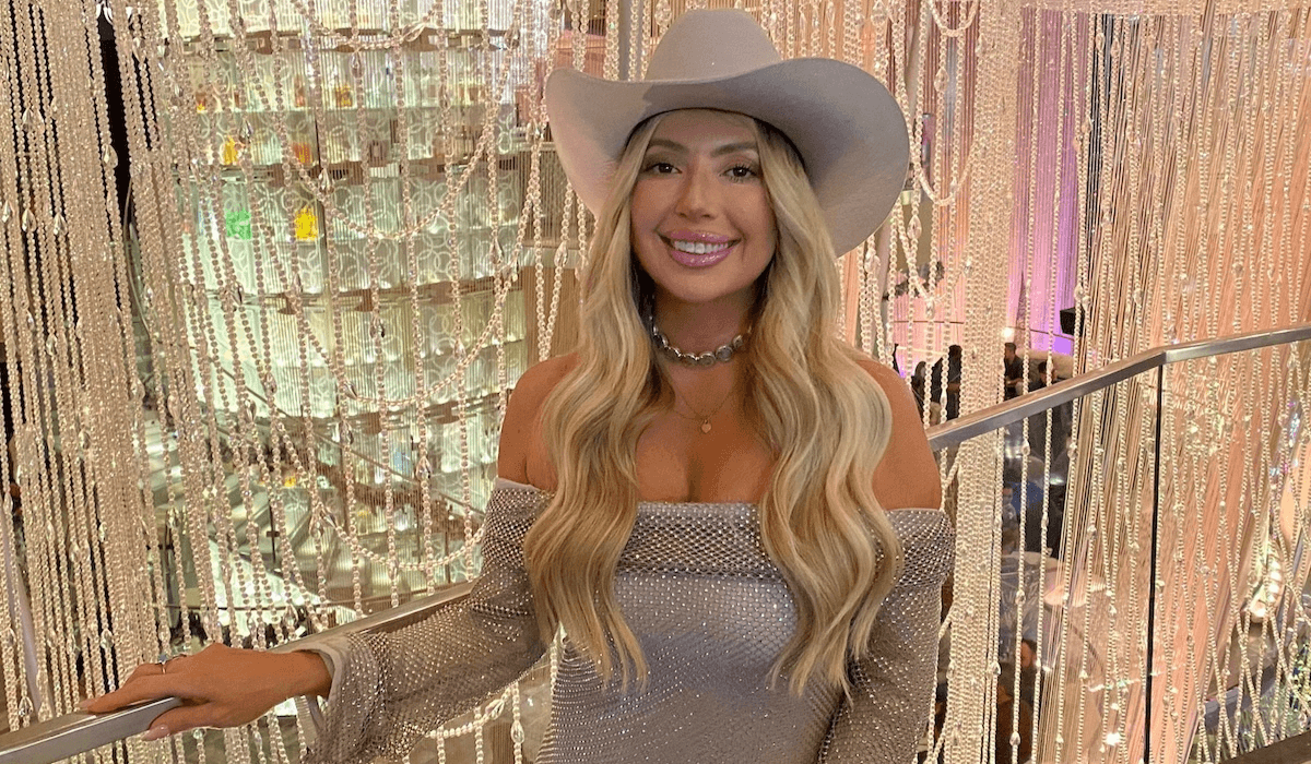 Founder and CEO of Rancher Hat Bar, Shantelle Girard, stands in front of the Chandelier Bar at The Cosmopolitan of Las Vegas.